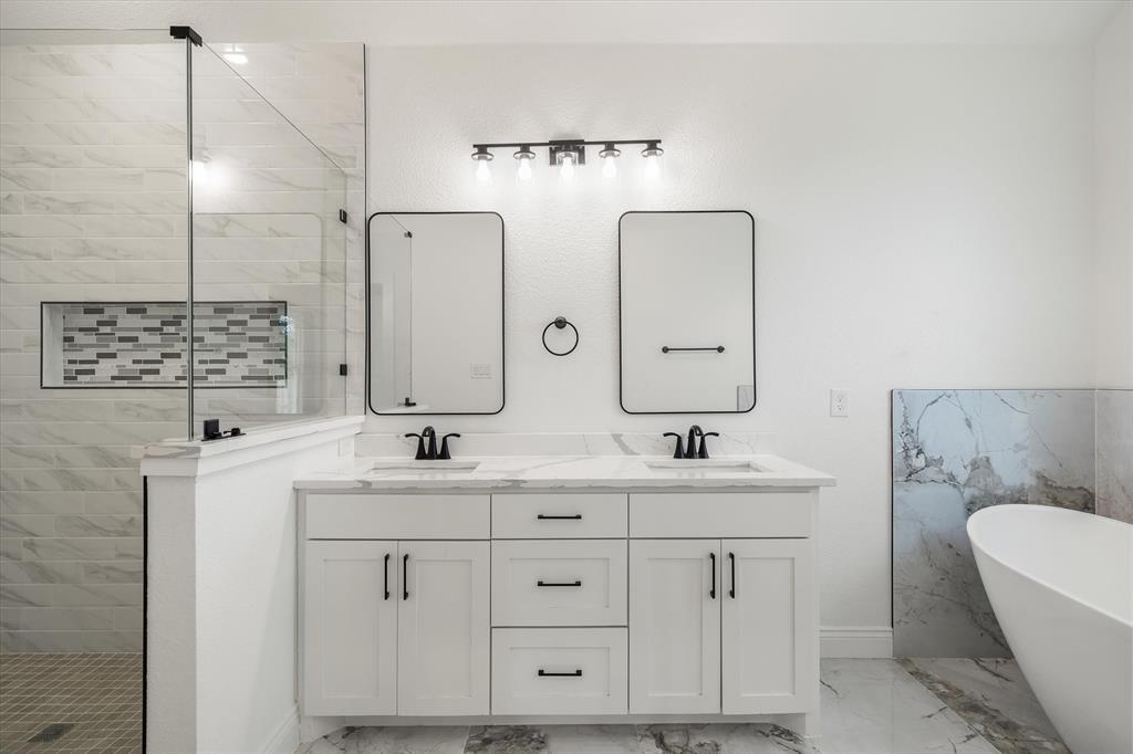 1868 Meadowview Canton, TX 75103 - Photo 31 of 40 a bathroom with a double vanity sink mirror and toilet