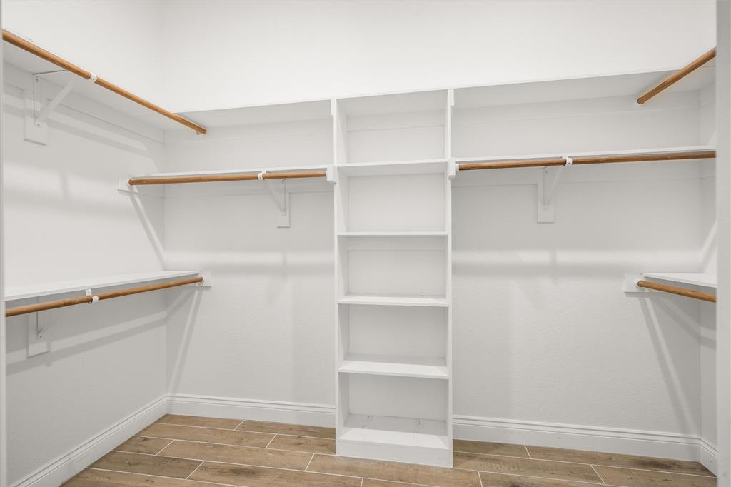 1868 Meadowview Canton, TX 75103 - Photo 34 of 40 a view of walk in closet with empty racks