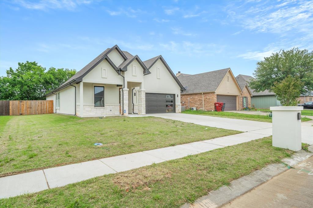1868 Meadowview Canton, TX 75103 - Photo 9 of 40 a view of a house with a yard and garage