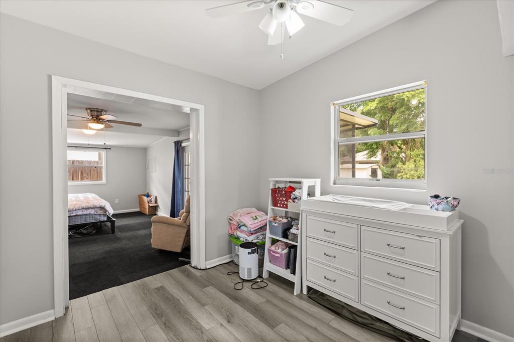 609 East Highland Street Altamonte Springs, FL 32701 - Photo 17 of 35 a bedroom with a bed and a dresser