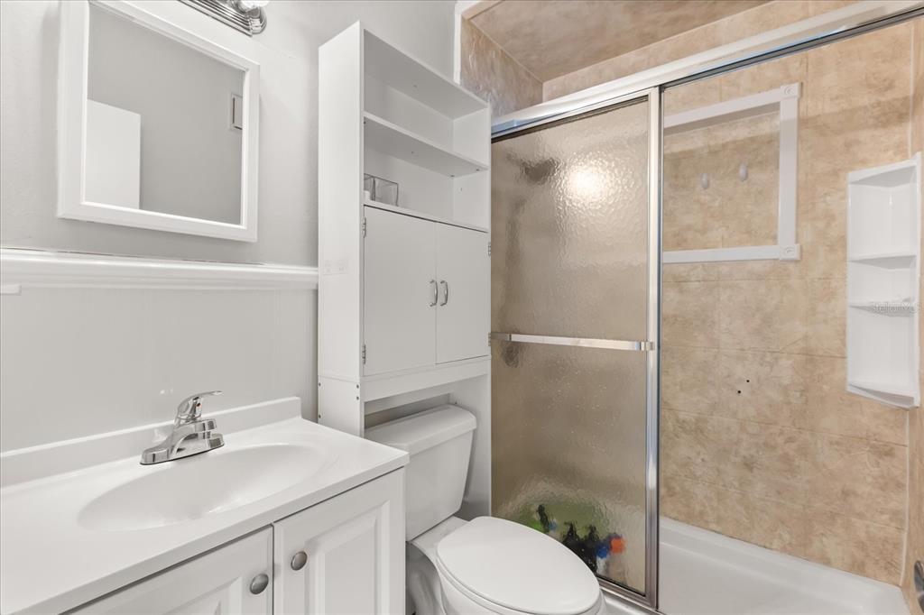 609 East Highland Street Altamonte Springs, FL 32701 - Photo 19 of 35 a bathroom with a sink toilet and shower