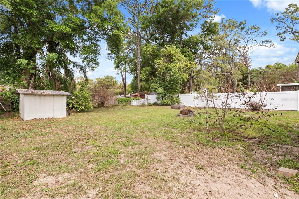 609 East Highland Street Altamonte Springs, FL 32701 - Photo 27 of 35 a backyard of a house with lots of green space