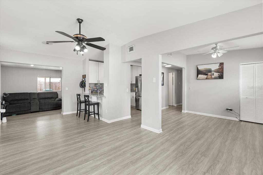 609 East Highland Street Altamonte Springs, FL 32701 - Photo 5 of 35 a view of a livingroom with furniture wooden floor and a ceiling fan