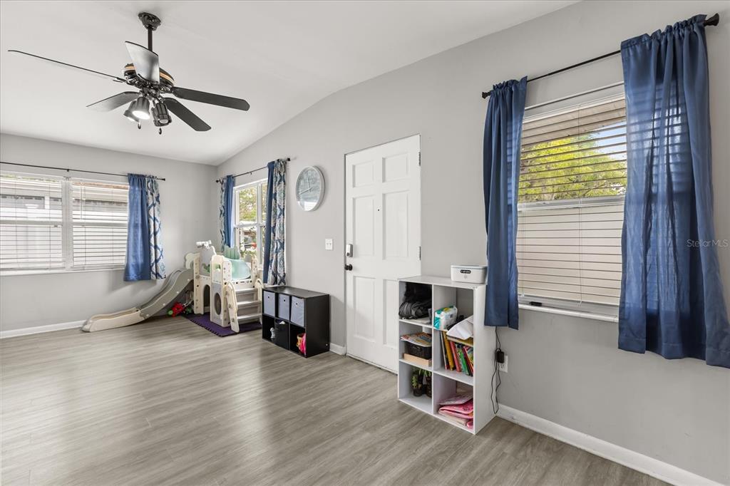 609 East Highland Street Altamonte Springs, FL 32701 - Photo 8 of 35 a living room with furniture and wooden floor