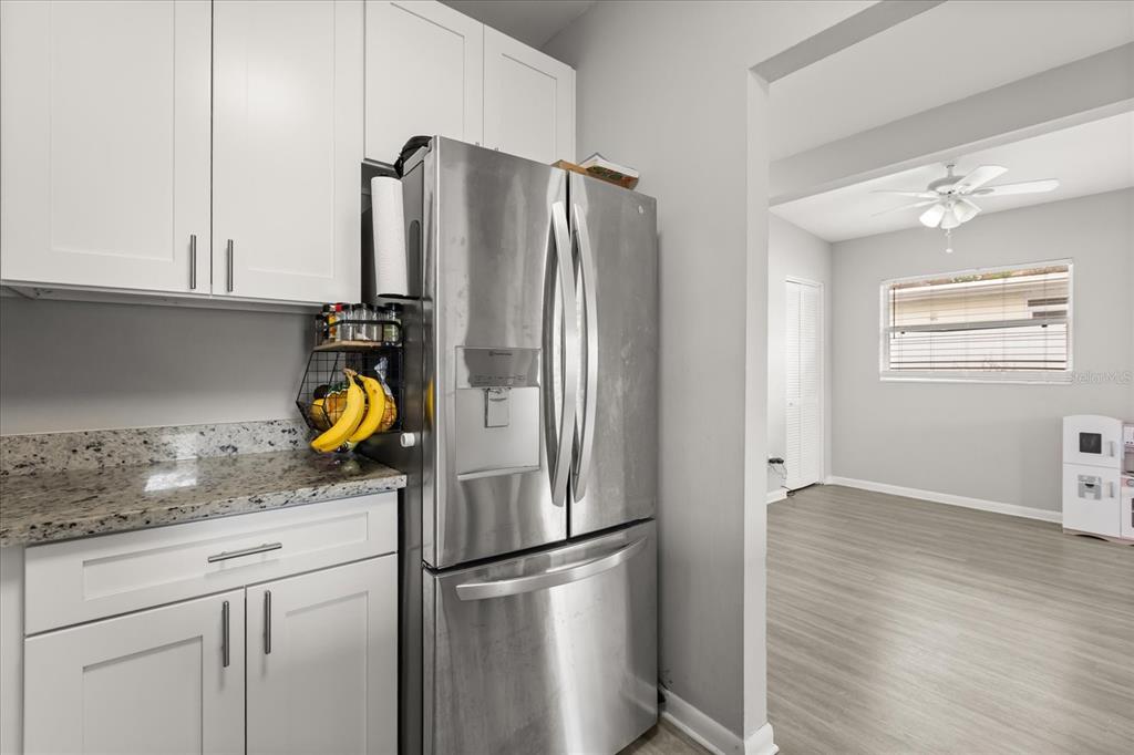 609 East Highland Street Altamonte Springs, FL 32701 - Photo 10 of 35 a kitchen with a refrigerator and a sink