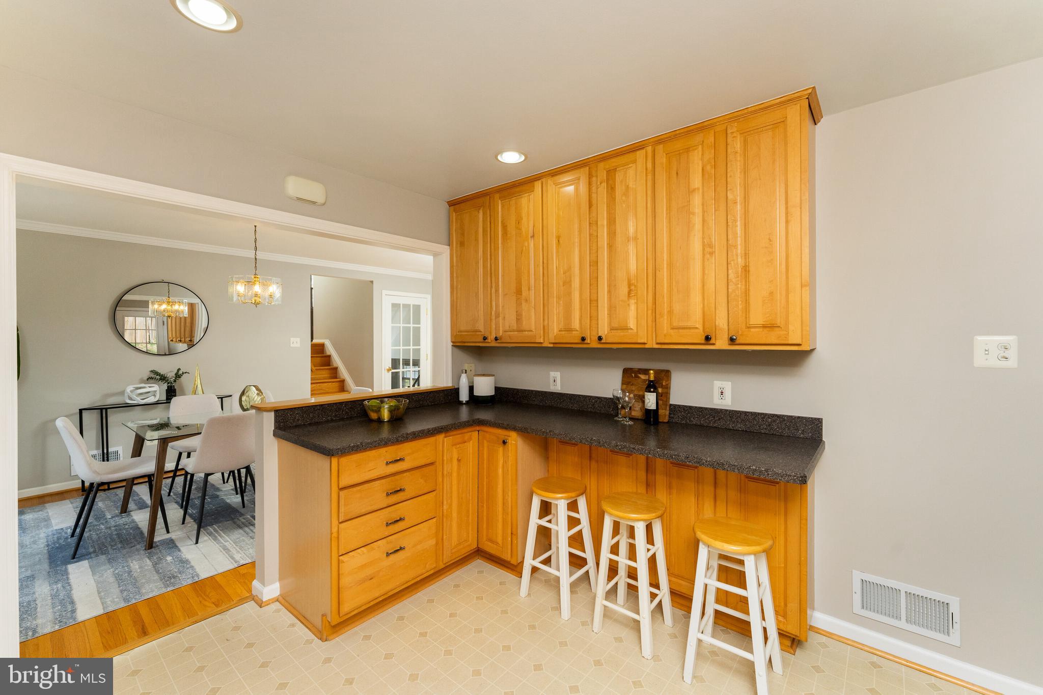 7013 Galgate Drive Springfield, VA 22152 - Photo 6 of 58 KITCHEN BREAKFAST BAR W/OPENING TO DINING AREA