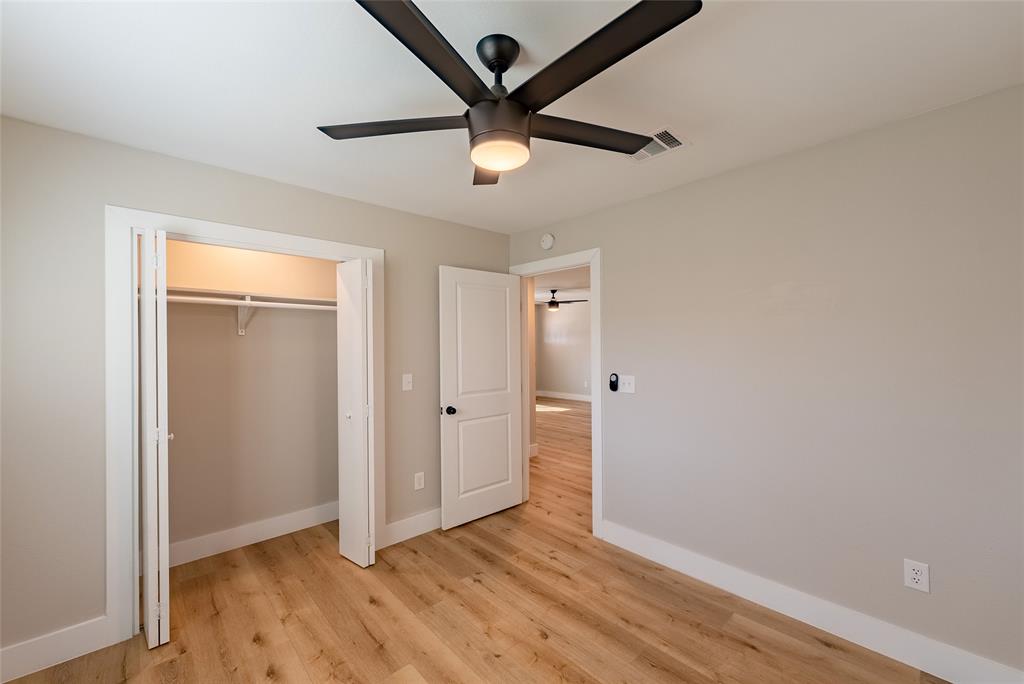 4306 Shallowbrook Trail, Unit A Austin, TX 78744 - Photo 11 of 16 wooden floor in an empty room