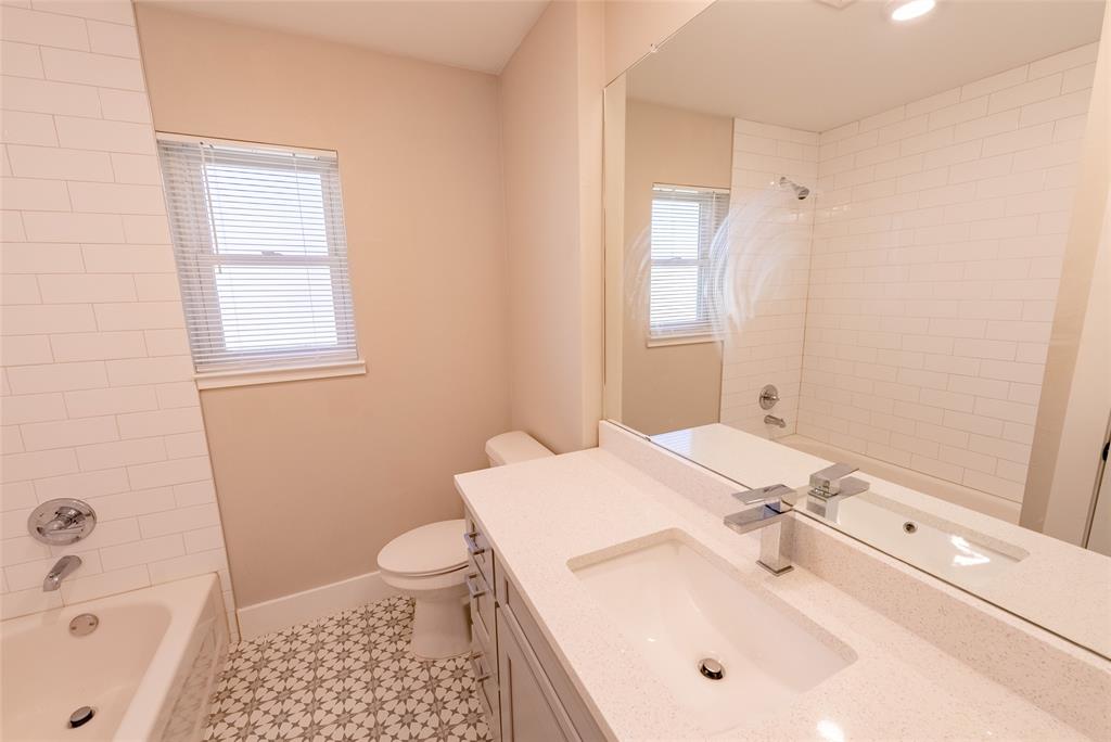 4306 Shallowbrook Trail, Unit A Austin, TX 78744 - Photo 12 of 16 a bathroom with a sink a toilet and shower