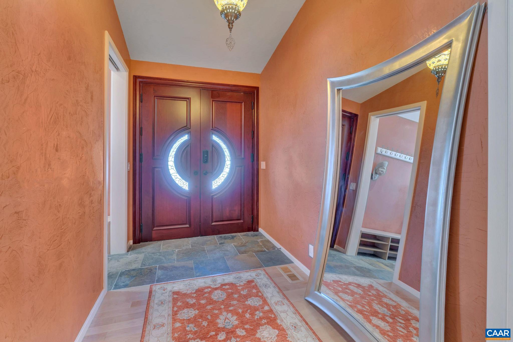 422 Unity Place Buckingham, VA 23921 - Photo 6 of 69 a view of a hallway with wooden floor and a mirror