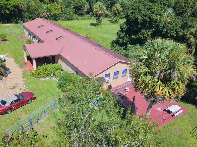 704 Southwest 6th Street Okeechobee, FL 34974 - Photo 11 of 21 an aerial view of a house with yard