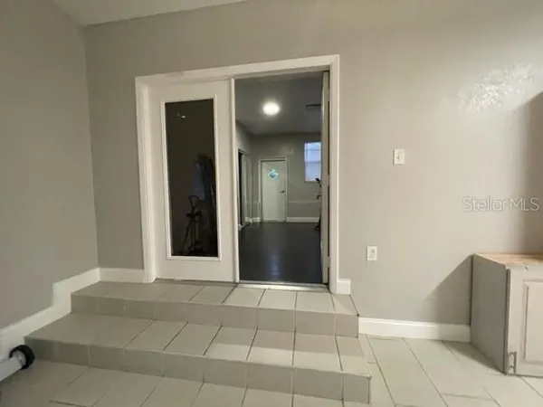 a view of a hallway with some shower