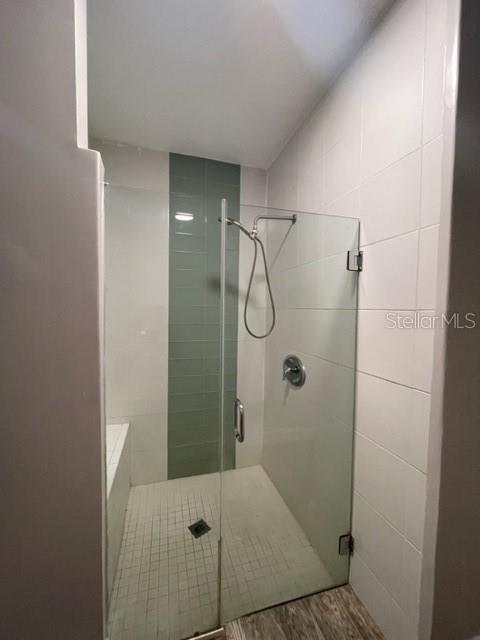 704 Southwest 6th Street Okeechobee, FL 34974 - Photo 14 of 21 a bathroom with a glass shower door