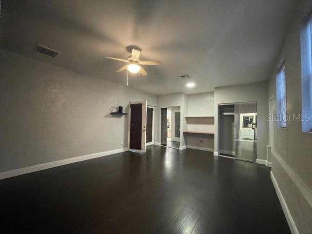 704 Southwest 6th Street Okeechobee, FL 34974 - Photo 21 of 21 a view of an empty room with a window and wooden floor