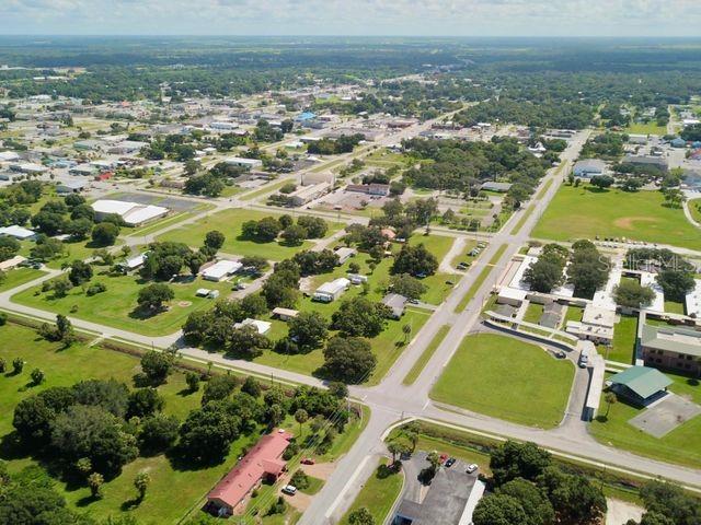 704 Southwest 6th Street Okeechobee, FL 34974 - Photo 3 of 21 an aerial view of residential houses with outdoor space
