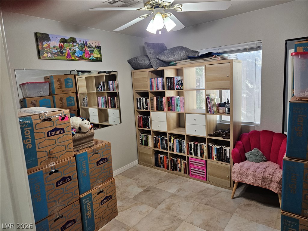 Tiled flooring and a large window define this versatile secondary space.