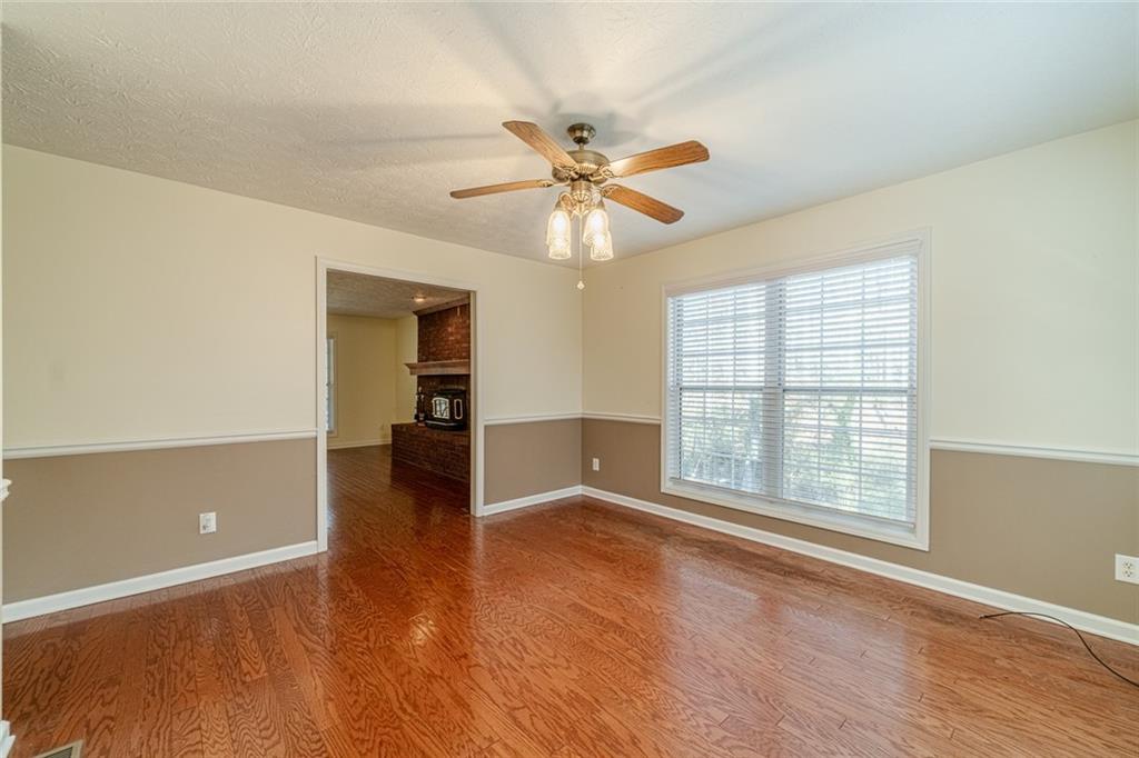 3240 Stewart Lake Road Monroe, GA 30655 - Photo 11 of 68 wooden floor in an empty room with a window