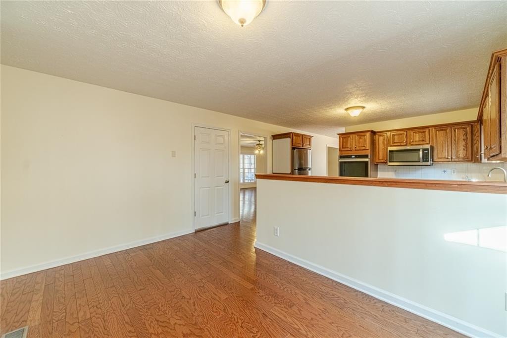 3240 Stewart Lake Road Monroe, GA 30655 - Photo 19 of 68 a view of a kitchen with an empty space