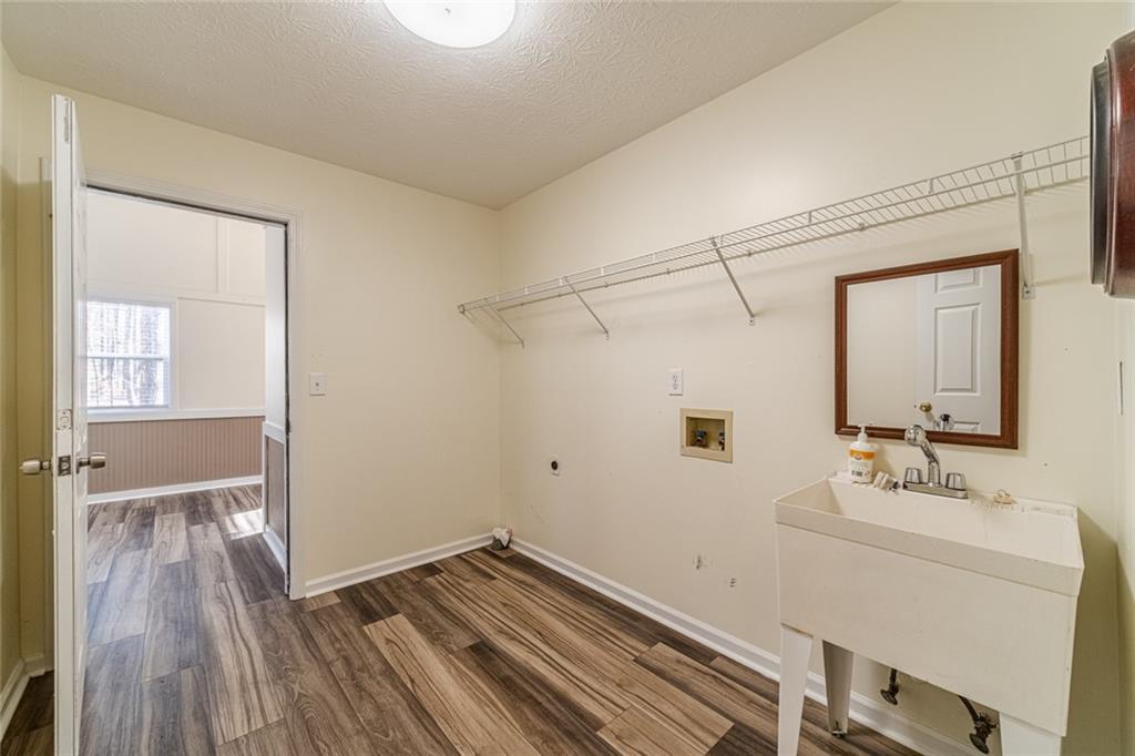 3240 Stewart Lake Road Monroe, GA 30655 - Photo 21 of 68 a bathroom with a sink mirror and shower