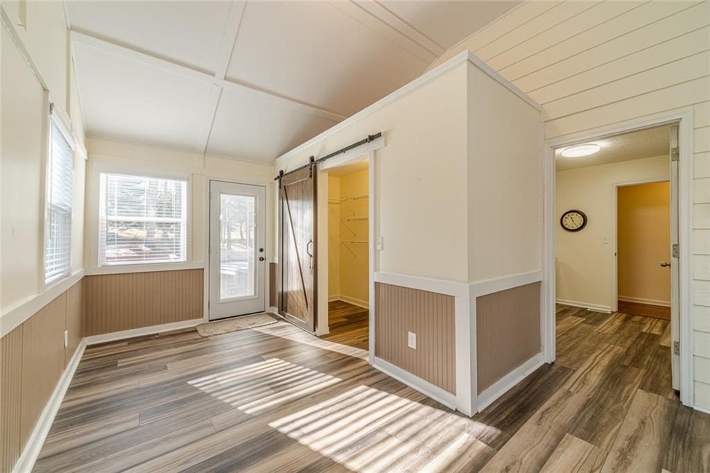3240 Stewart Lake Road Monroe, GA 30655 - Photo 23 of 68 a view of a room with wooden floor and furniture