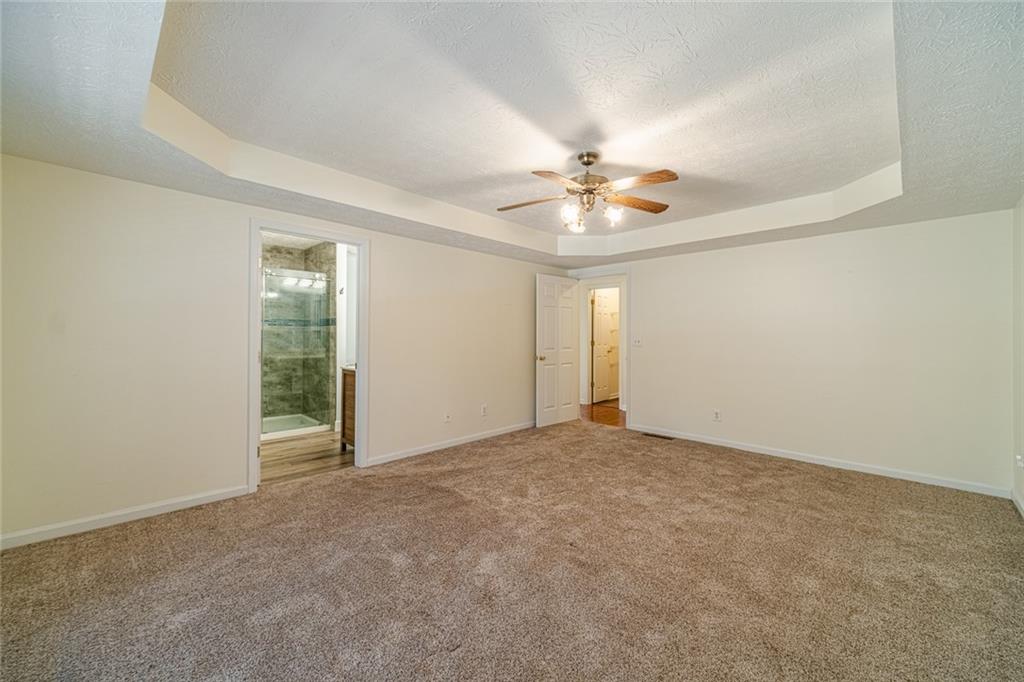 3240 Stewart Lake Road Monroe, GA 30655 - Photo 26 of 68 an empty room with fan and a ceiling fan