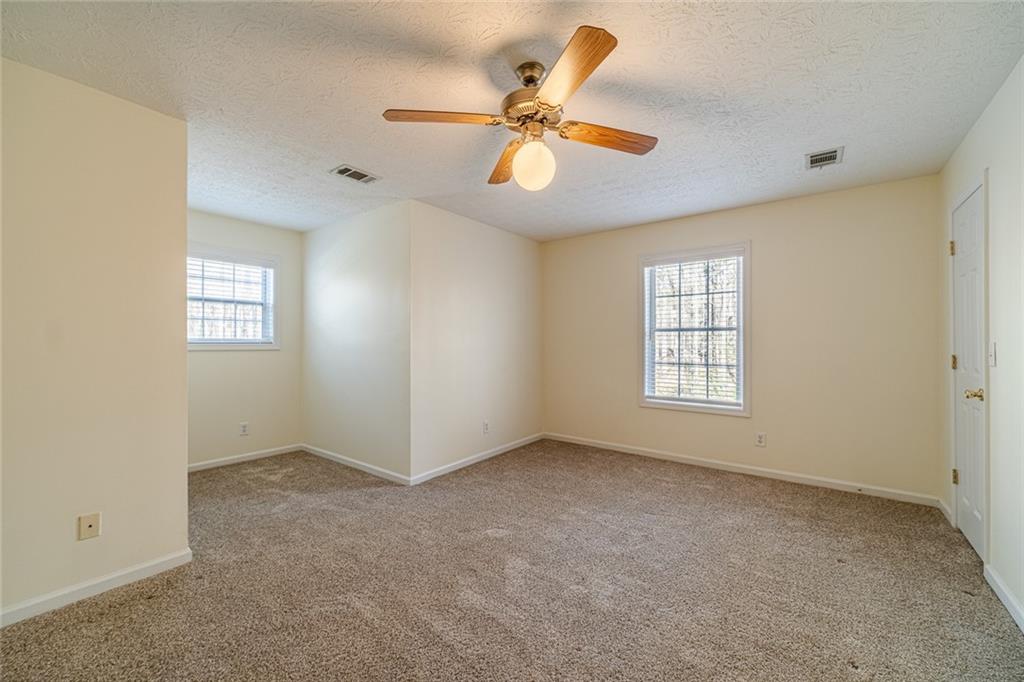 3240 Stewart Lake Road Monroe, GA 30655 - Photo 33 of 68 a view of an empty room with a window