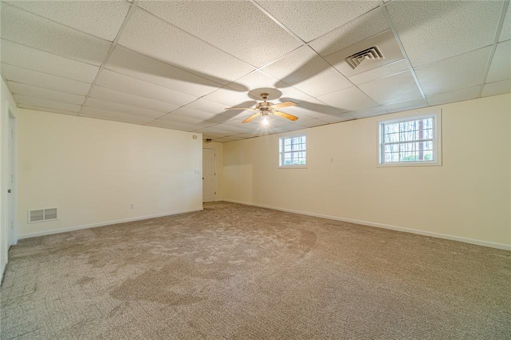 3240 Stewart Lake Road Monroe, GA 30655 - Photo 45 of 68 a view of an empty room with a window
