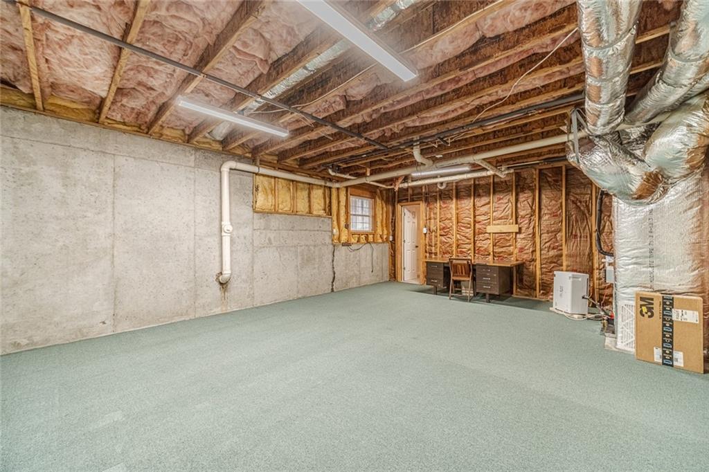 3240 Stewart Lake Road Monroe, GA 30655 - Photo 48 of 68 a view of an empty room with a fireplace
