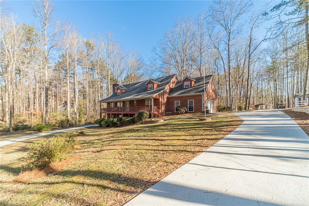 3240 Stewart Lake Road Monroe, GA 30655 - Photo 50 of 68 a front view of a house with a yard