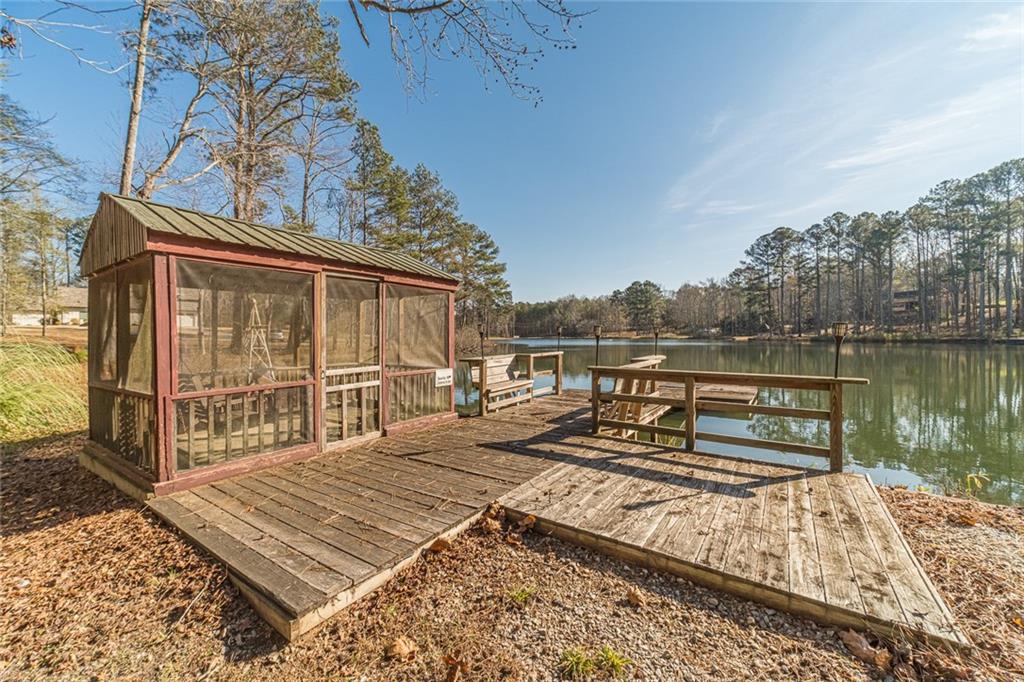 3240 Stewart Lake Road Monroe, GA 30655 - Photo 60 of 68 a view of a roof deck with chair and wooden floor