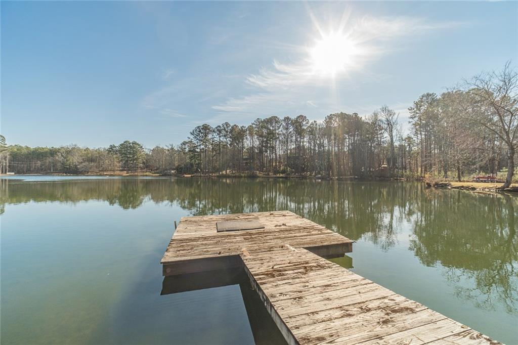 3240 Stewart Lake Road Monroe, GA 30655 - Photo 62 of 68 a view of a lake with houses
