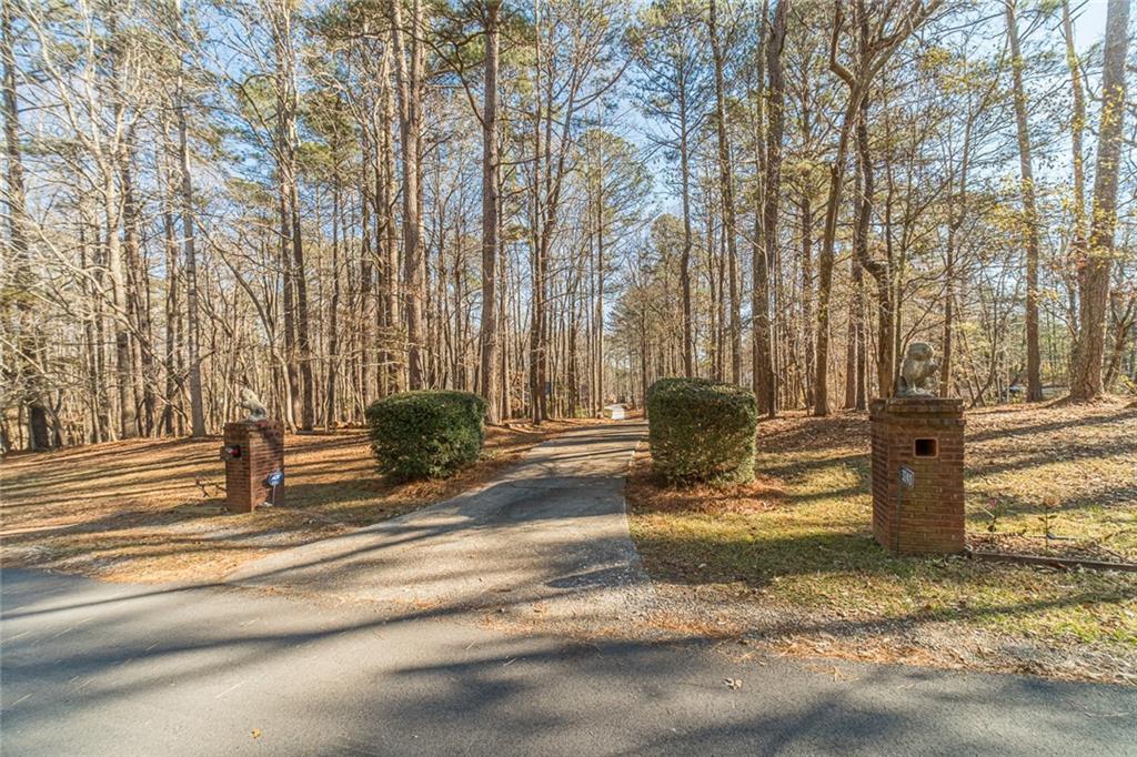 3240 Stewart Lake Road Monroe, GA 30655 - Photo 64 of 68 a view of a fountain in the middle of a road