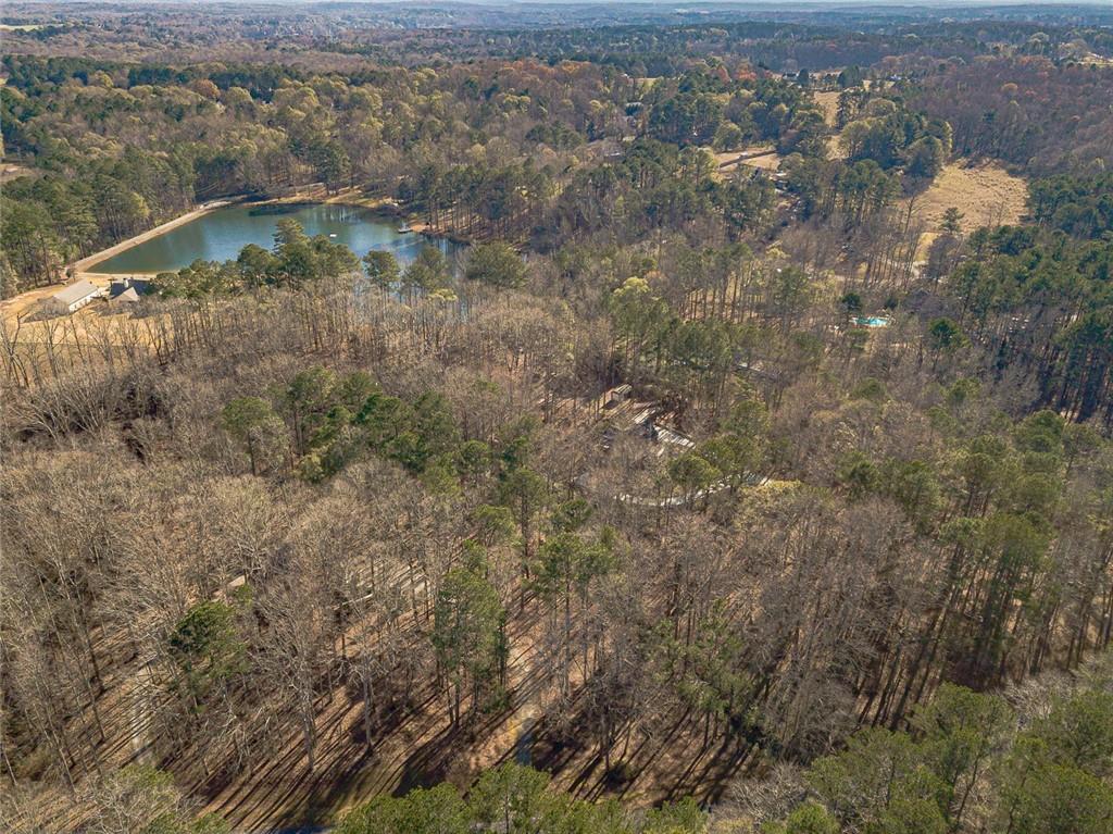 3240 Stewart Lake Road Monroe, GA 30655 - Photo 66 of 68 a view of a houses with a yard