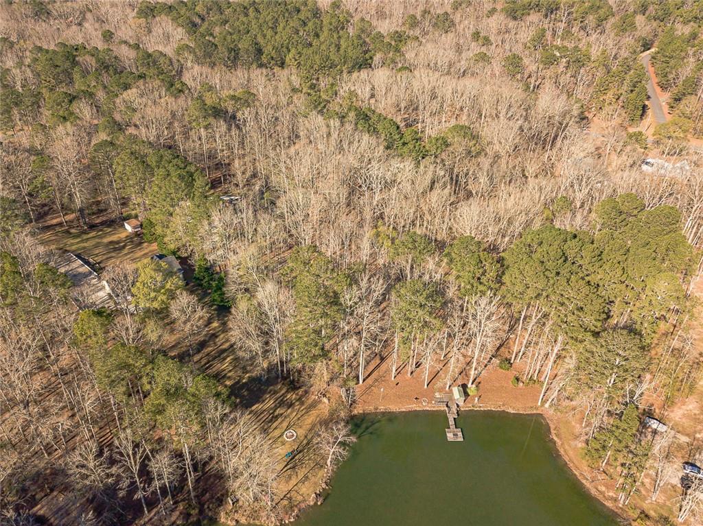 3240 Stewart Lake Road Monroe, GA 30655 - Photo 68 of 68 a backyard of a house with a yard