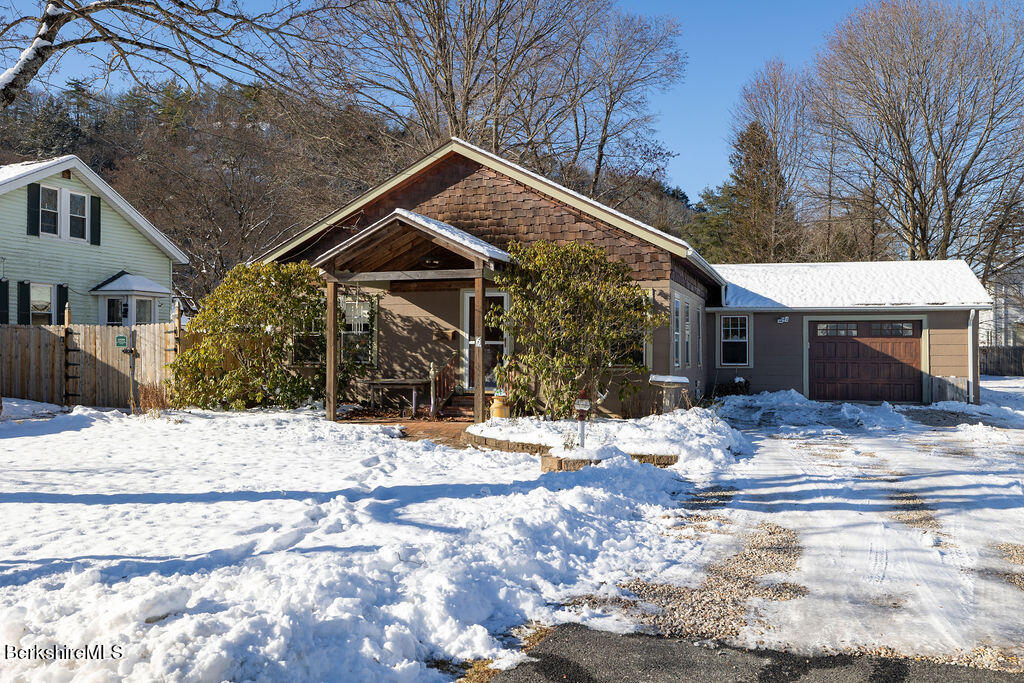 6 Locust Street Great Barrington, MA 01230 - Photo 1 of 36 a view of a house with snow on the road