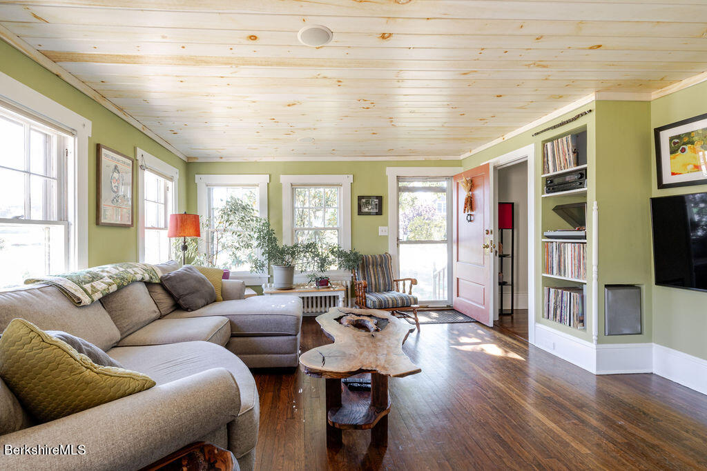 6 Locust Street Great Barrington, MA 01230 - Photo 16 of 36 a living room with furniture and a flat screen tv