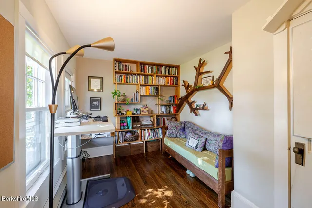 a view of an entryway with wooden floor