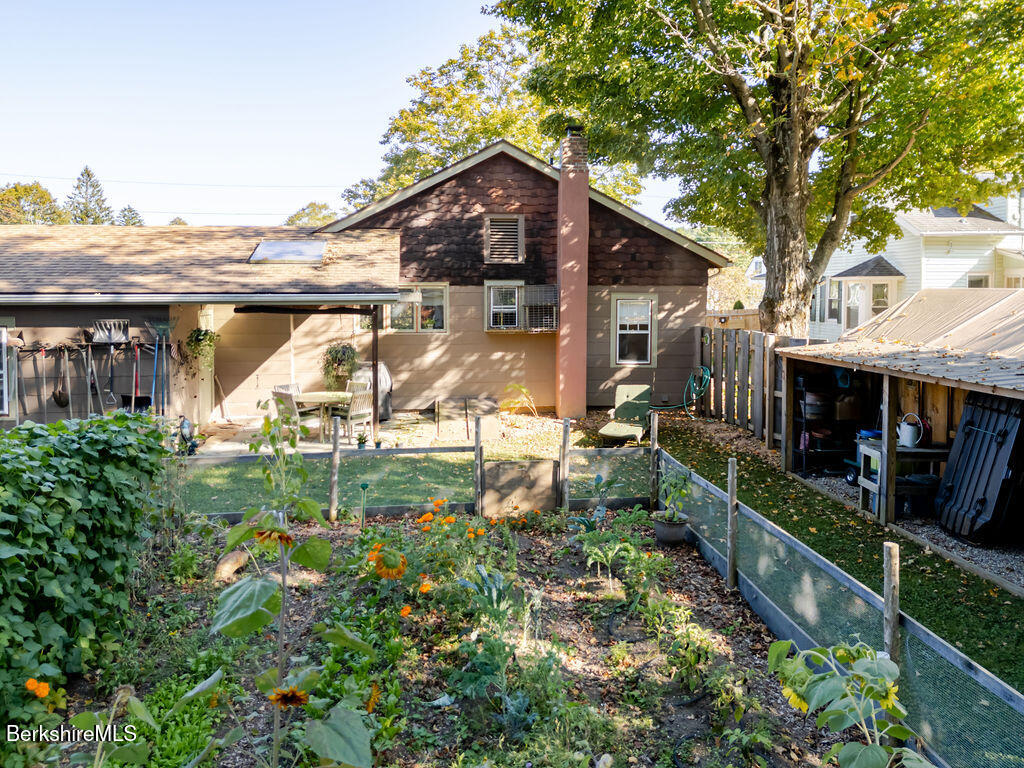 6 Locust Street Great Barrington, MA 01230 - Photo 34 of 36 a view of a house with a yard and potted plants