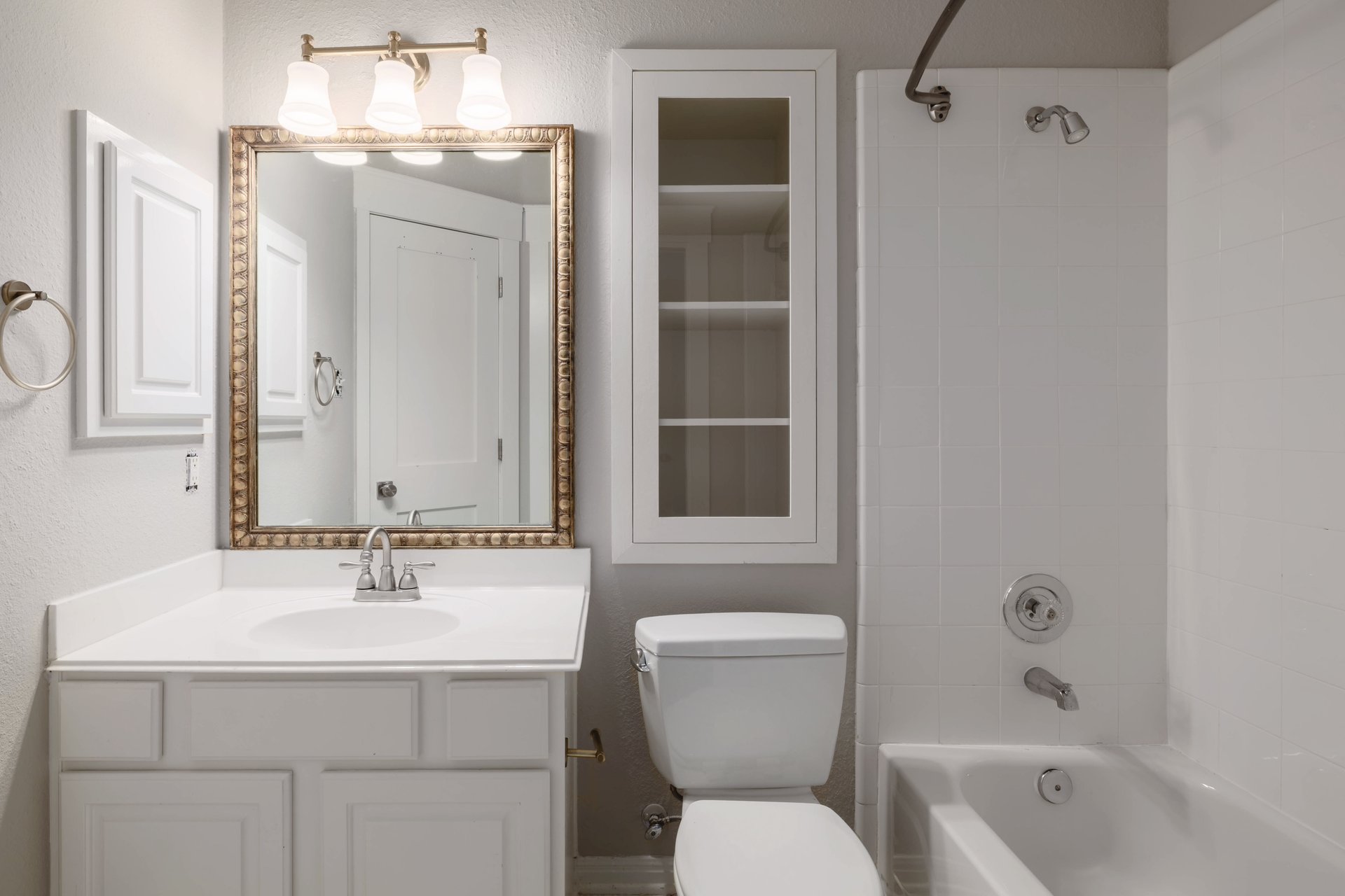 5512 Ballenton Lane Austin, TX 78739 - Photo 30 of 40 A well-appointed bathroom features a single vanity, a framed mirror, and a classic tub and shower combination.