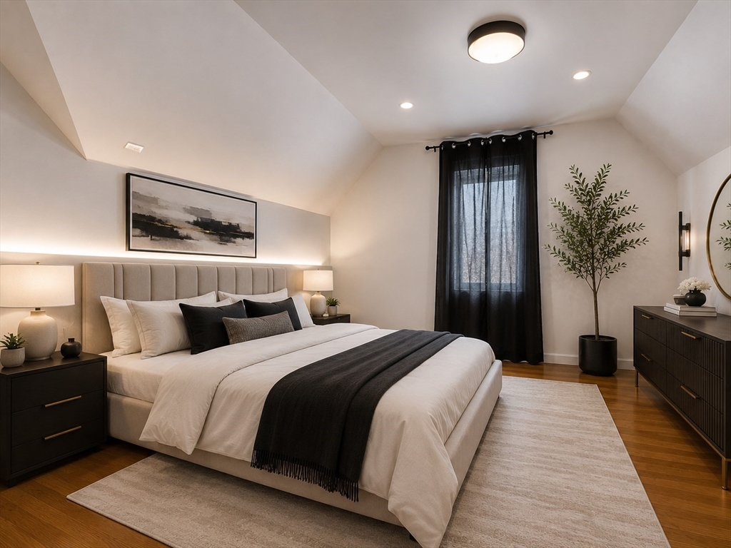 5 Myrtle Street, Unit 3 Saugus, MA 01906 - Photo 9 of 15 a bedroom with a large bed and a chandelier