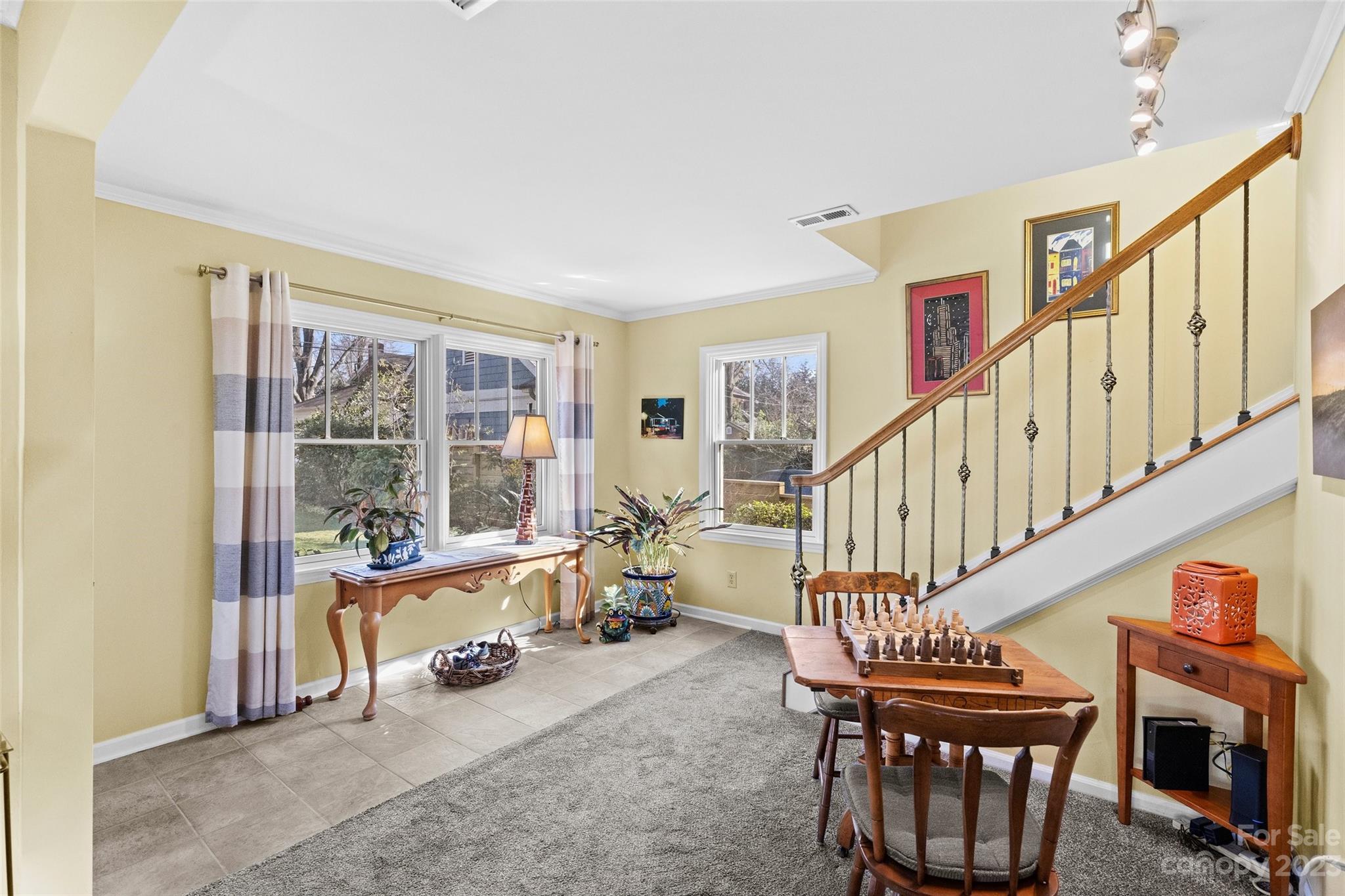 711 Romany Road Charlotte, NC 28203 - Photo 14 of 28 a living room with furniture a fireplace and a large window