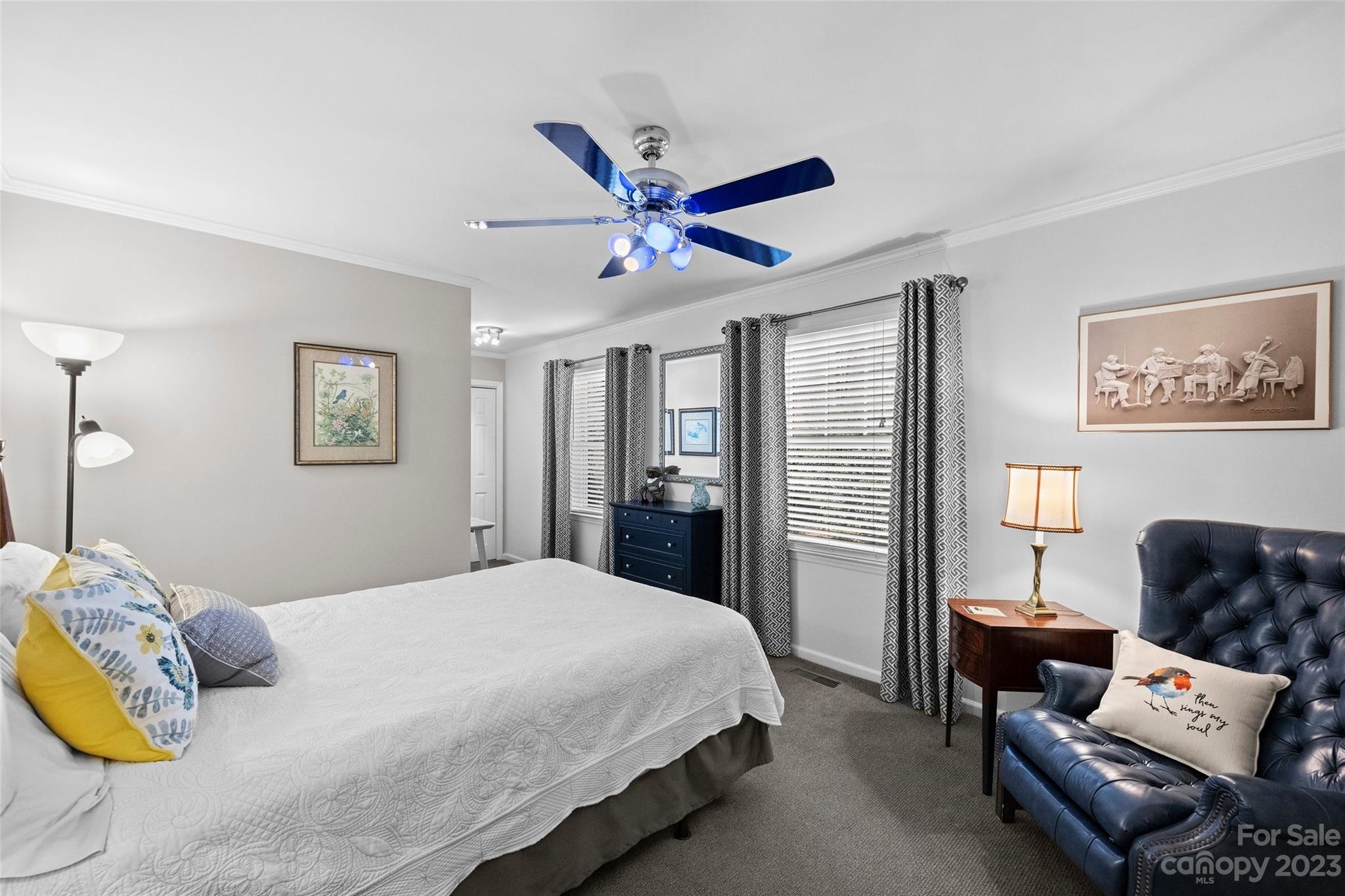 711 Romany Road Charlotte, NC 28203 - Photo 15 of 28 a bedroom with a bed and wooden floor