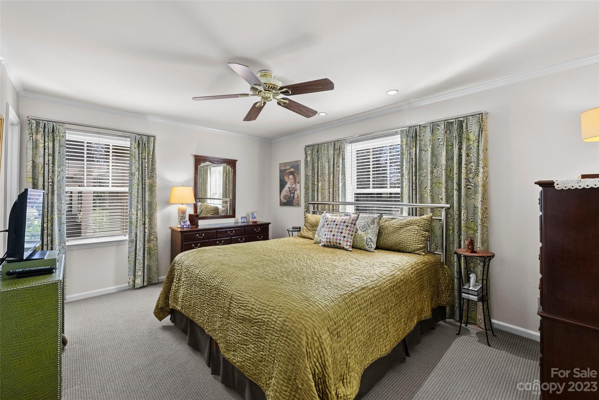 711 Romany Road Charlotte, NC 28203 - Photo 18 of 28 a bedroom with a bed wooden floor and window