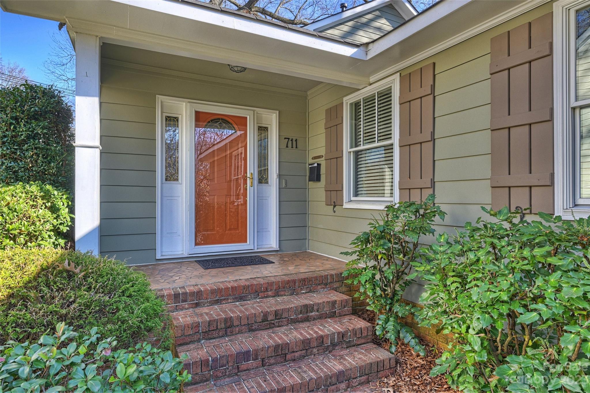 711 Romany Road Charlotte, NC 28203 - Photo 2 of 28 a front view of a house with a yard