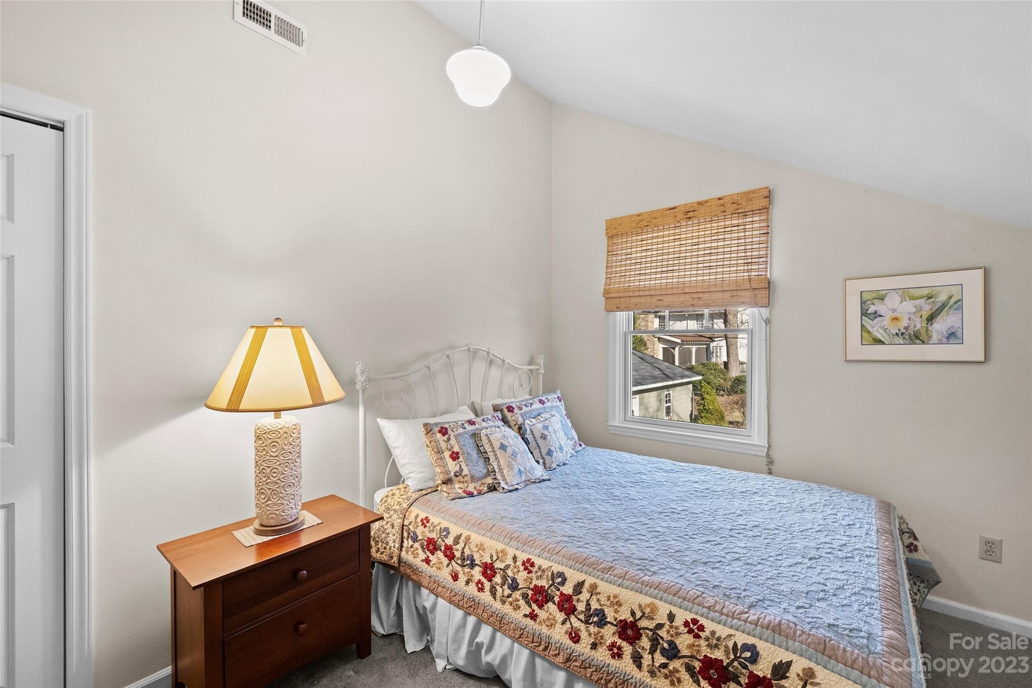 711 Romany Road Charlotte, NC 28203 - Photo 21 of 28 a bedroom with a bed and a window