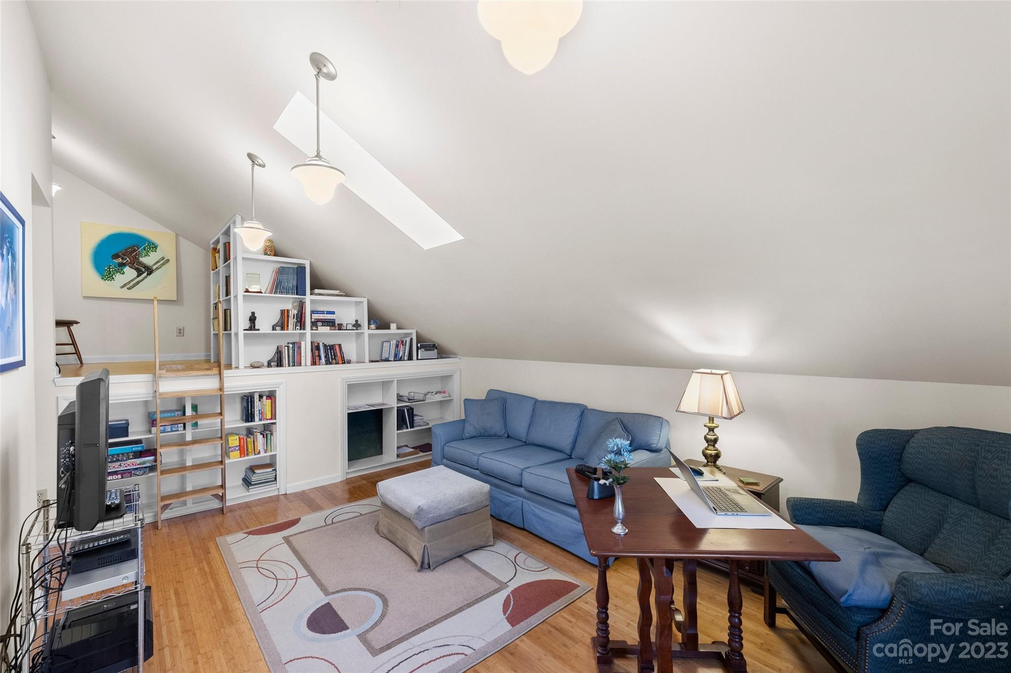 711 Romany Road Charlotte, NC 28203 - Photo 23 of 28 a living room with furniture and a wooden floor
