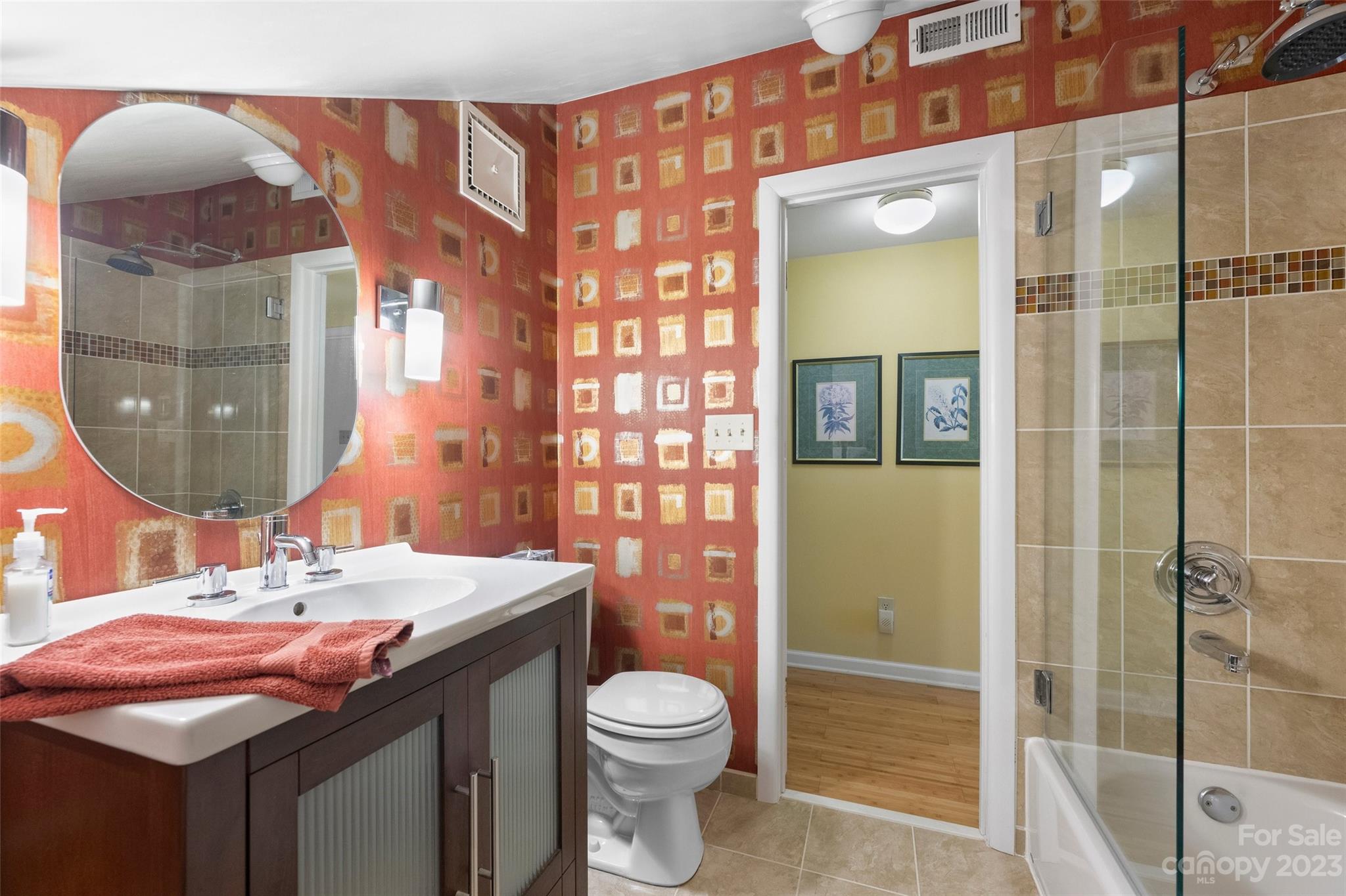 711 Romany Road Charlotte, NC 28203 - Photo 24 of 28 a bathroom with a sink toilet and shower