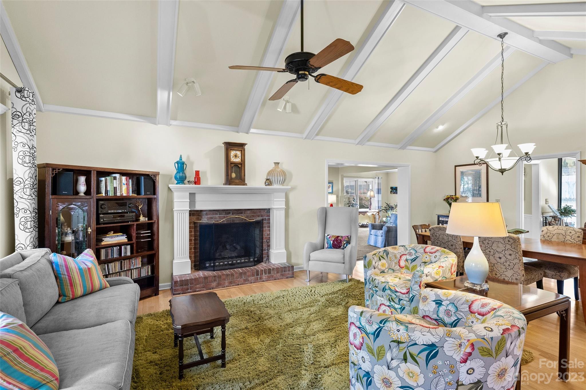 711 Romany Road Charlotte, NC 28203 - Photo 5 of 28 a living room with furniture fireplace and a chandelier