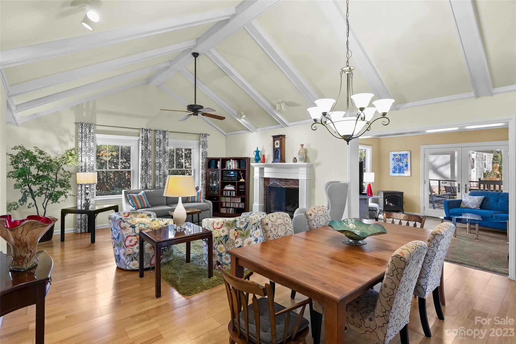 711 Romany Road Charlotte, NC 28203 - Photo 7 of 28 a view of a dining room with furniture a chandelier and wooden floor