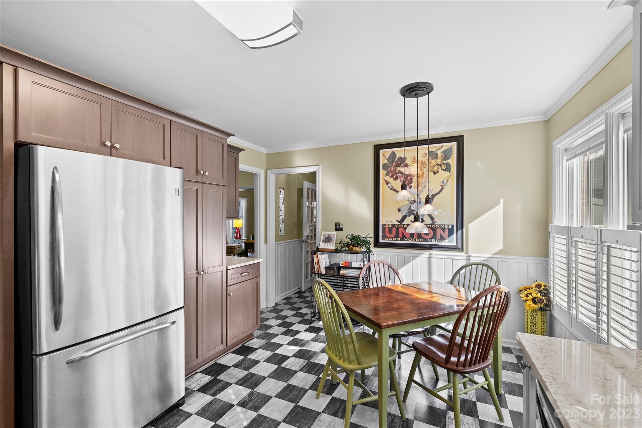 711 Romany Road Charlotte, NC 28203 - Photo 10 of 28 a view of a dining room with furniture window and wooden floor