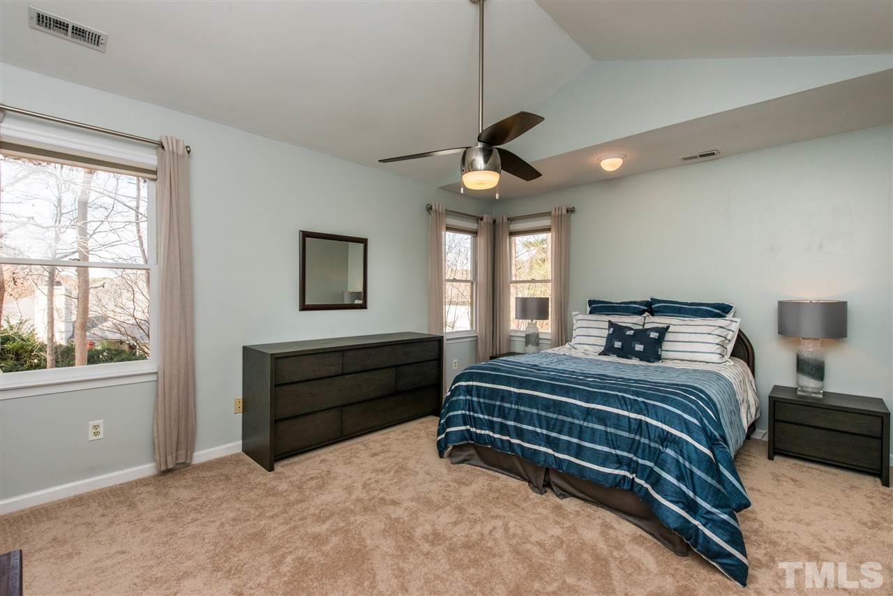5504 Edgebury Road Raleigh, NC 27613 - Photo 14 of 25 a bedroom with a bed and a window